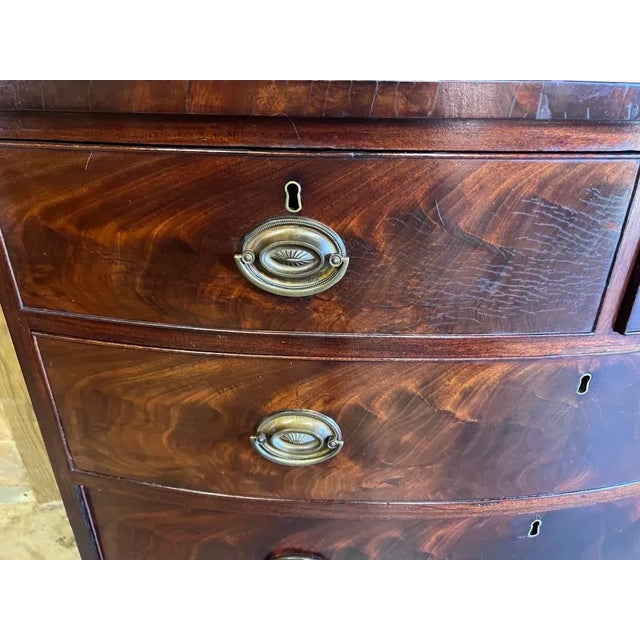 Antique Flame Mahogany Bow Front Chest of Drawers. Early 19th Century
