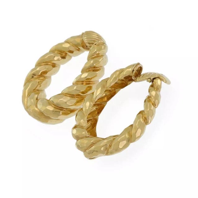 This is a beautiful pair of earrings. They are exquisitely crafted in 17k yellow gold with a hand hammered polished finish...