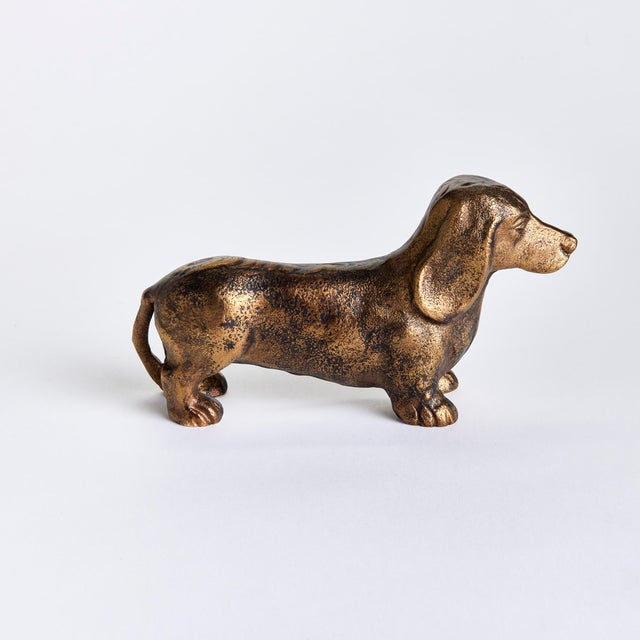 Made of a heavy cast aluminum, this regal dachshund sculpture is worthy of a prime bookshelf spot. With realistic...