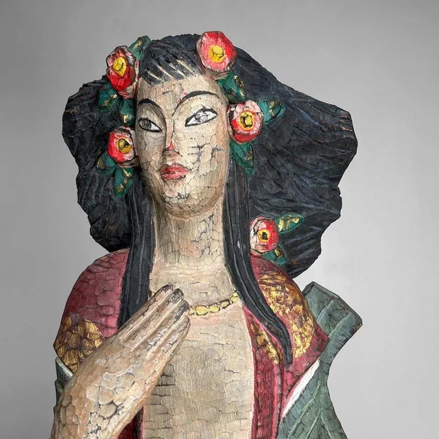 This large, hand-carved wooden sculpture is a colorful and striking addition to any interior. The female figure is...