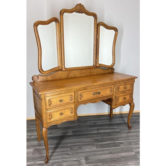 A beautifully crafted Vintage French Louis dressing table , showcasing an elegant oak finish, graceful cabriole legs and...