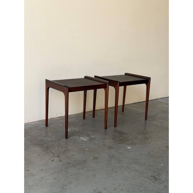 Beautiful pair of vintage Danish rosewood nightstands by Heltborg Møbler, featuring rich rosewood grain, elegant tapered...