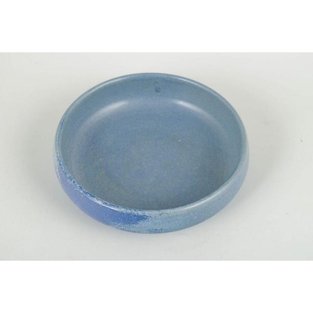 L. Hjorth, bornholm bowl, 1960s. Hand-thrown stoneware bowl in a low, rounded form with a matte blue glaze in gently...