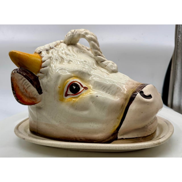 A wonderfully whimsical Victorian Staffordshire majolica serving dish modeled as a charming cow’s head, complete with...