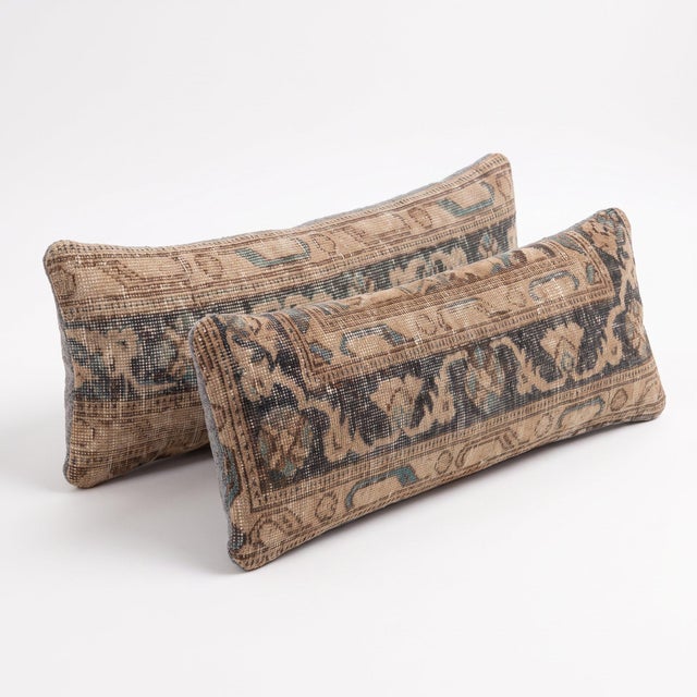 This 12'' x 35'' pillow cover set was made from authentic Turkish rug pieces — camel tan field with dark teal and brown...