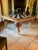 Exceptional MacKenzie-Childs Train dining table featuring an oversized square checkerboard top and four spectacular...