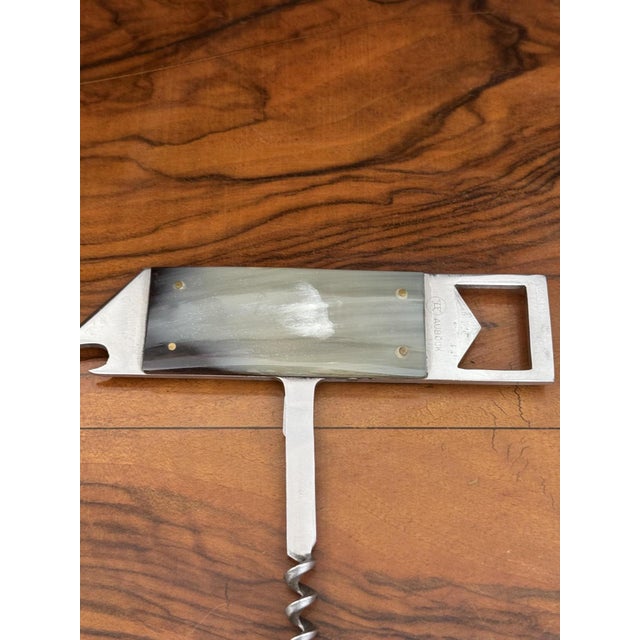 Auböck - Can opener, bottle opener, and corkscrew "Barboy" Stainless steel, horn, length 12.5 cm In good, used condition...