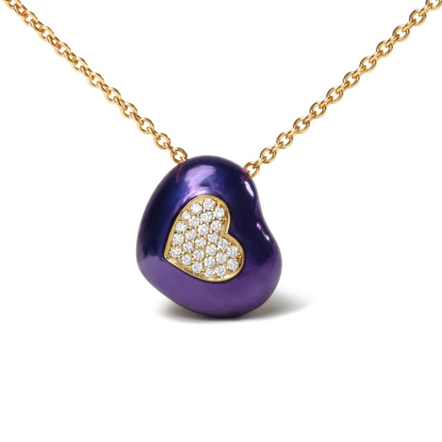 This sweet heart-shaped pendant necklace will set her heart all aflutter, cast in 18k yellow gold with blue enamel. A...
