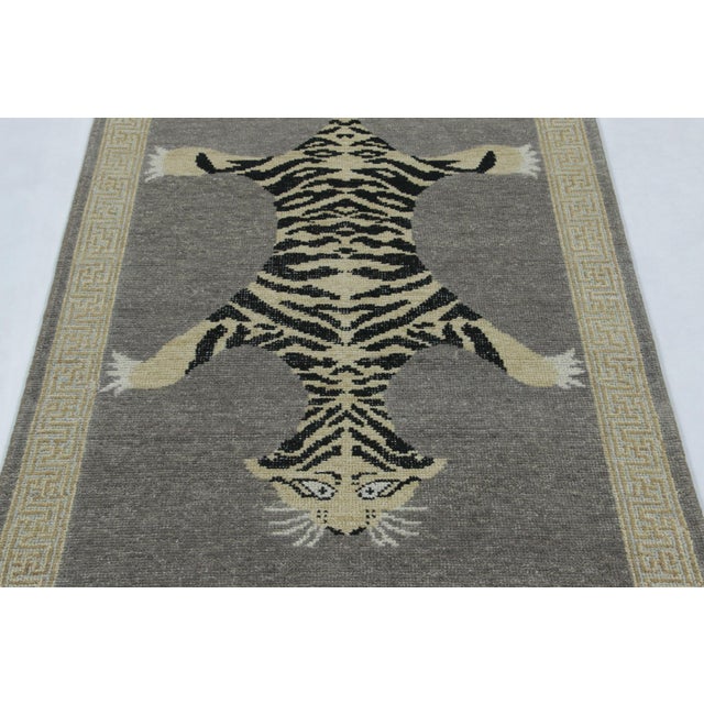 Hand-knotted in wool, this 3x10 runner rug is a striking new addition to our Distressed Homage collection, inspired by a...