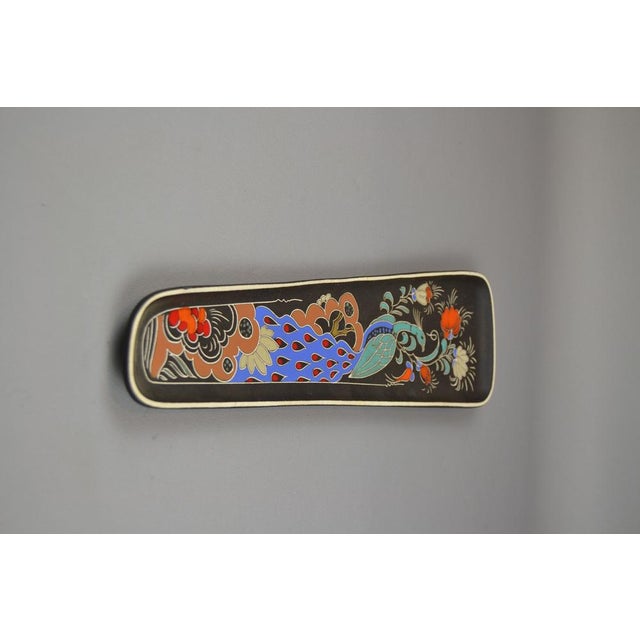 Wall plaque from Arnold Wiig Fabrikker, Norway. These highly collectible pieces feature colorful glossy glazes on a matte...