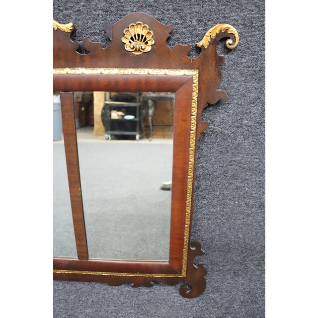 Federal style over the mantle mirror with gilded eagle and shell carved accents.