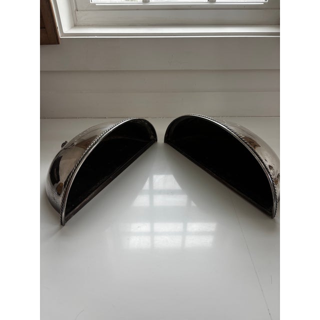 Pair of Vintage silver cloche reimagined as handsome pair of wall sconces. Can be wired for lighting or filled with...