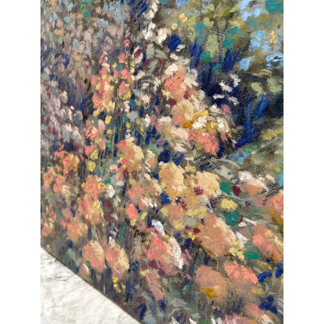 Large lush canvas painting of a French garden filled with countryside flowers and greenery. Impressionist style...