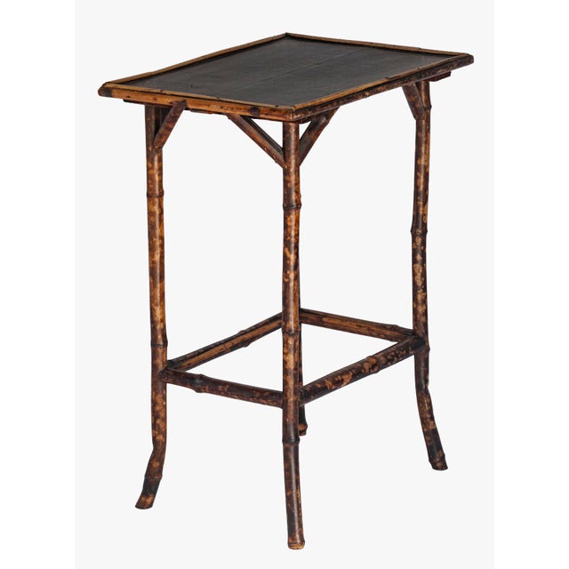 A Charming Vintage Petite Tortise Bamboo Side Table. A Painted Top Surface with Design in the corners. Lightweight. Add...
