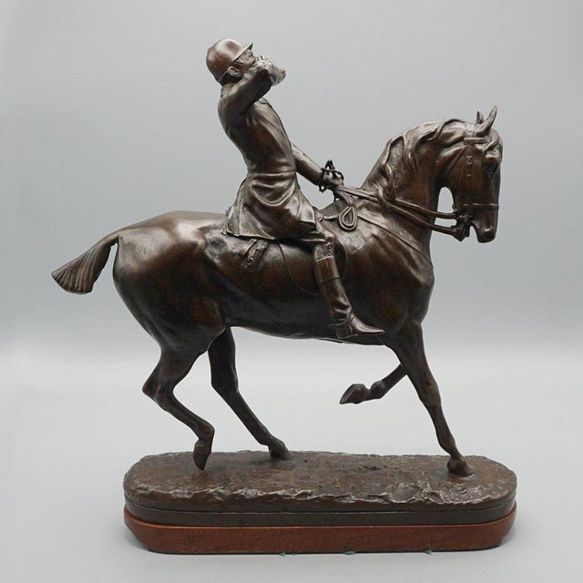 The whip' a patinated bronze sculpture by john willis good (1845-1878) depicting a young huntsman. Set over a naturalistic...