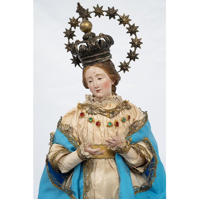 Antique sculpture depicting the Immaculate Madonna with hands and feet in wood and a terracotta head with glass eyes. The...