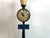 Unique small table top clock designed to resemble a Parisian street lamp. Paint Green with Gilt Brass Houses 8-day...