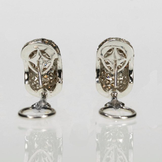 18k White gold earrings with 72 round brown diamonds weighing approximately 2.75 carats and 54 round white diamonds...