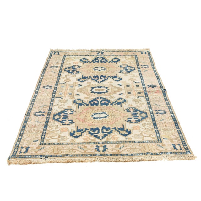 Vintage handknotted washed out Caucasian wool rug. Approximately 60-70 years old. In very good condition.