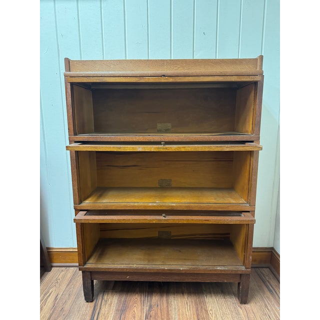 Vintage oak 3 Stack Barrister bookcase, manufactured by the Globe Wernicke company. Early 20th Century. Makers mark is...