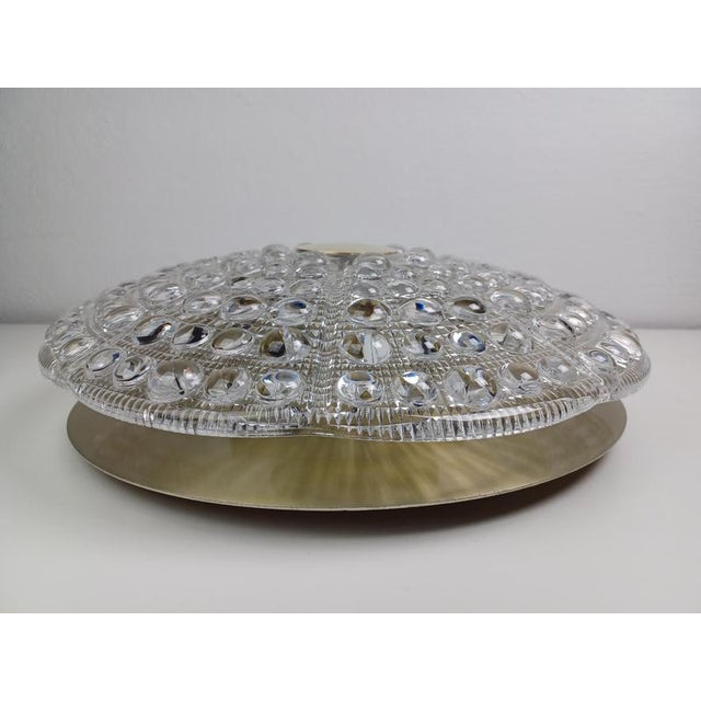 Mid-century flush mount chandelier in glass and brass by Carl Fagerlund for Lyfa. The flushmount chandelier feature a...