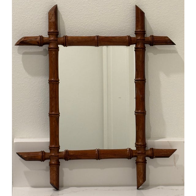 A charming, petite in scale, antique French wall mirror featuring faux bamboo frame. ****There is currently no hardware on...