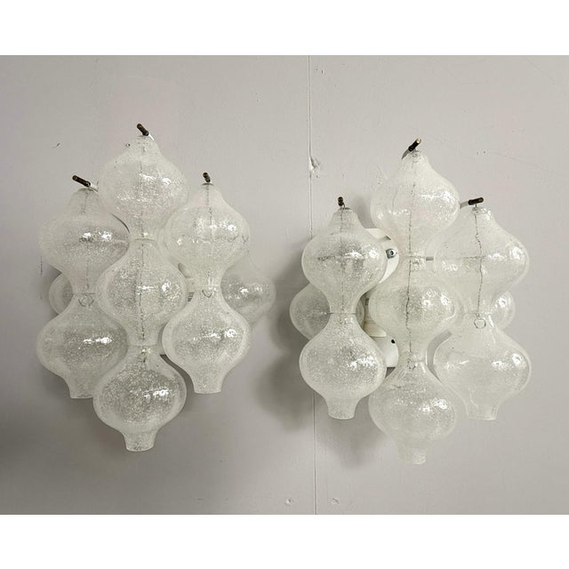 Construction with a frame made of white lacquered metal, pendant made of clear glass with bubble inclusions, 2 lighting...