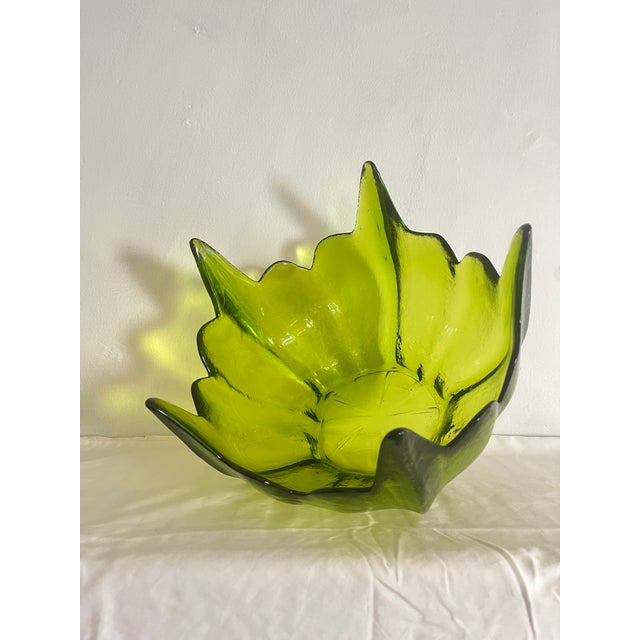 Featuring an exaggerated scalloped edge, this bowl is the perfect centerpiece for your MCM table or kitchen island! Serve...