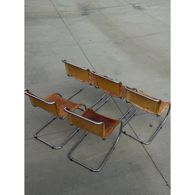A refined example of modernist design, the MR10 chair by Ludwig Mies van der Rohe pairs a cantilevered chrome frame with a...