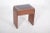 Piano bench. with a simple, solid rectangular structure, it reflects a functional aesthetic characteristic of mid-20th...