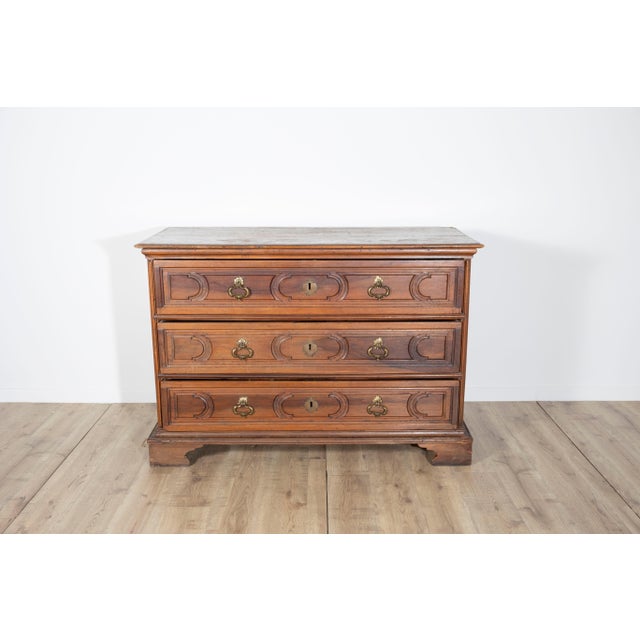 A stately and rare mid-17th century walnut chest of drawers from the Emilian region of Italy, attributed to Bolognese...