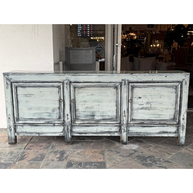 Design Plus Gallery presents a Distressed Finish Farmhouse Sideboard. The piece is antique in age from the late 19th...