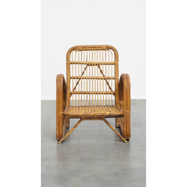 This stunningly beautiful, luxurious vintage rattan designer armchair from the 1950s is a real eye-catcher, if you ask us....