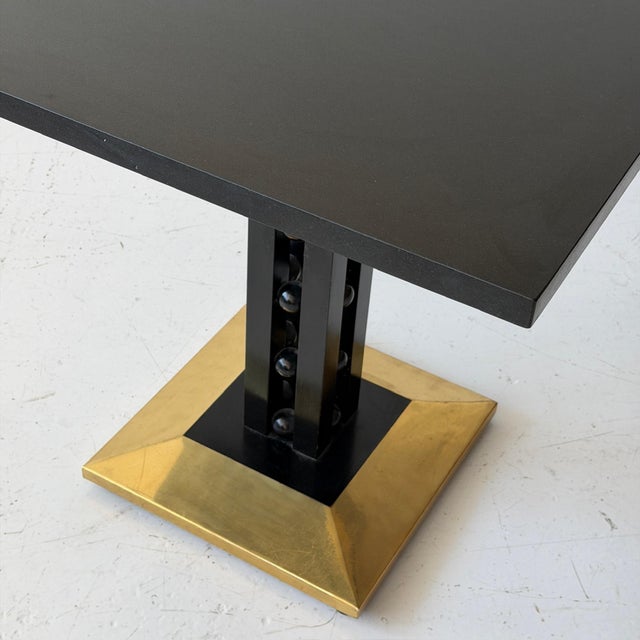c. 20th Century. Austria. Gold base with black painted frame, granite top. This piece is attributed to the mentioned...