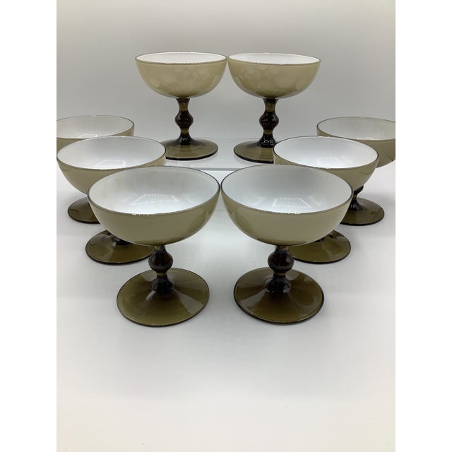 A Rare and gorgeous set of mid century hand blown Carlo Moretti cased glass champagne coupes in the very elegant and...