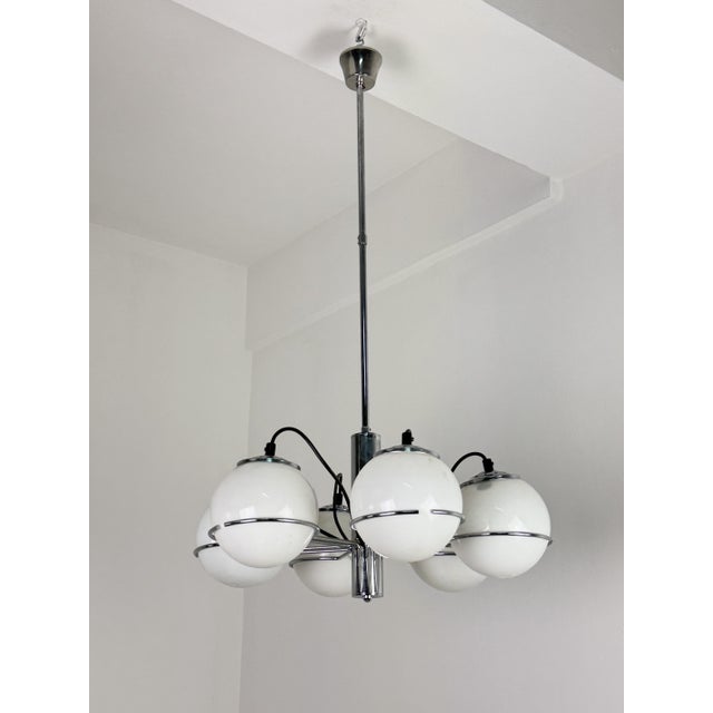 Space-Age 6-light chandelier by Targetti Sankey, 1970 Chromed metal frame with opal glass globes. E14 bulbs Intact and in...