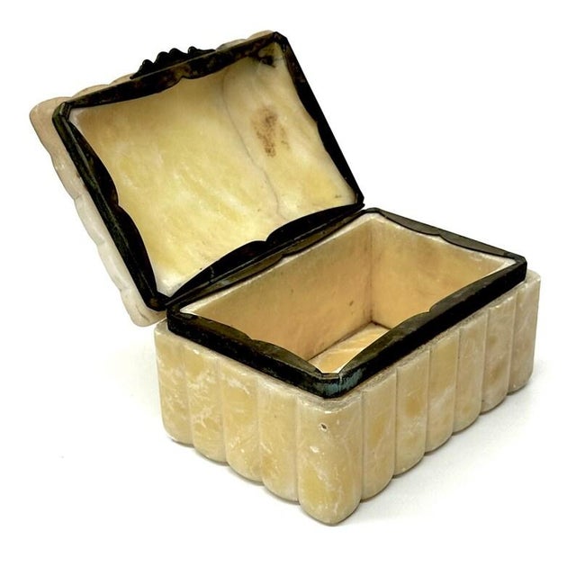 This is a rare, delicate alabaster and brass jewelry box. This heavy stone box features carved scallop detailing....
