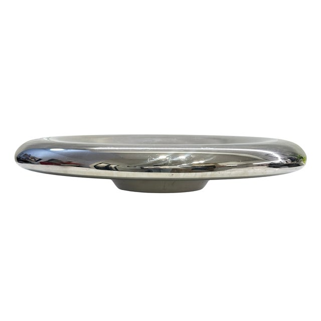 A striking vintage sculptural centerpiece bowl crafted in highly polished chrome-finished metal. The piece features a...
