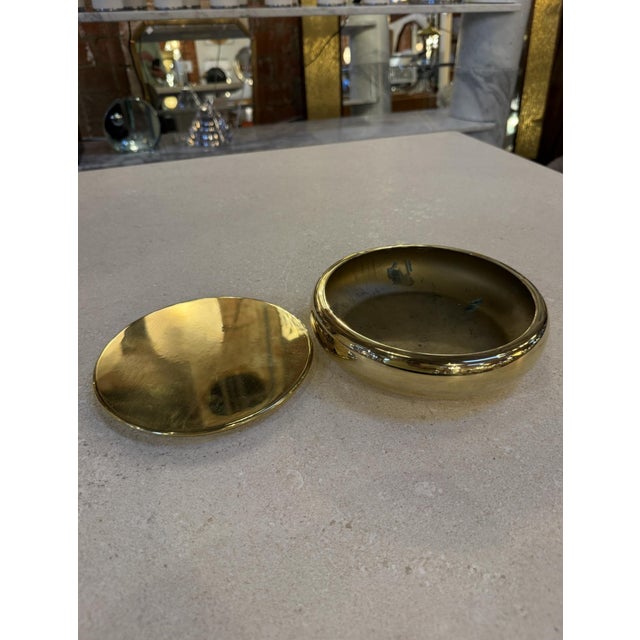 Elegant mid-century Italian brass box with matching lid, defined by its softly rounded profile and warm golden patina. The...