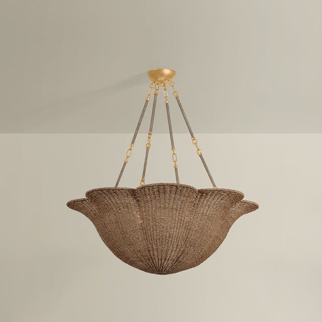 The Ardonia family pairs two trending design elements, scallops and naturals. Woven tightly from abaca fibers, the upward-...