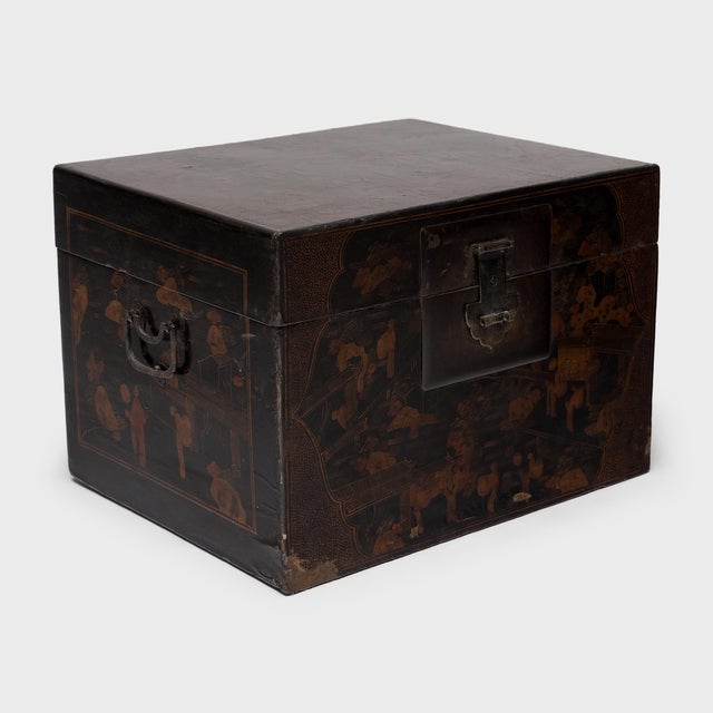 Each side of this vintage Chinese trunk is decorated with scenery of a lavish mountainside palace, brushed with intricate...