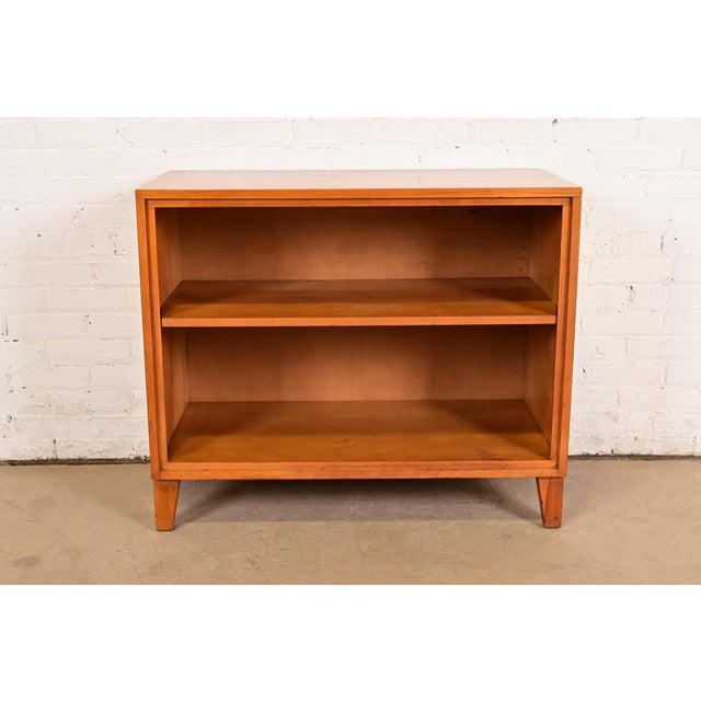 An sleek and stylish Mid-Century Modern solid birch bookcase By Leslie Diamond for Conant Ball USA, 1950s Measures: 36"W x...