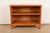 An sleek and stylish Mid-Century Modern solid birch bookcase By Leslie Diamond for Conant Ball USA, 1950s Measures: 36"W x...