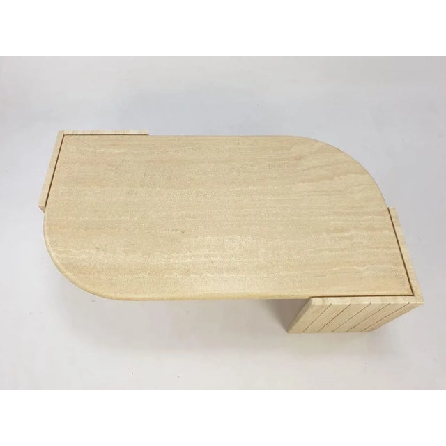 Very elegant Italian Coffee Table handcrafted out of travertine. The beautiful teardrop shaped top is rounded on the edge....