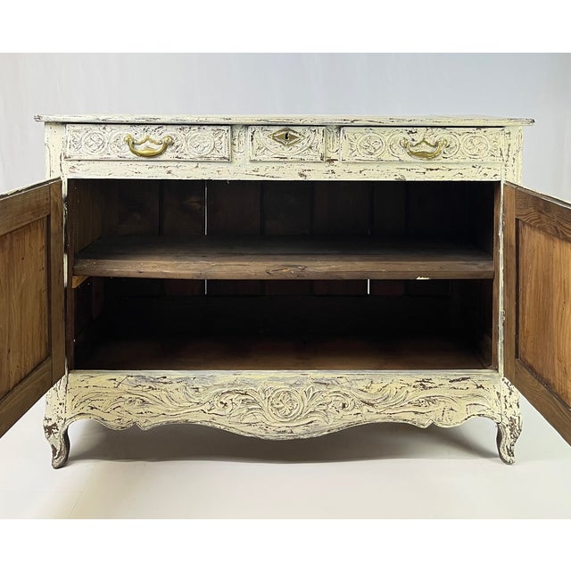 An exceptional 18th-century (or early 19th-century) French Provincial buffet from the Louis XV period, having deep...