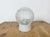 Vintage industrial ceiling or wall light made in former Czechoslivakia during the 1970s. It features a white porcelain...