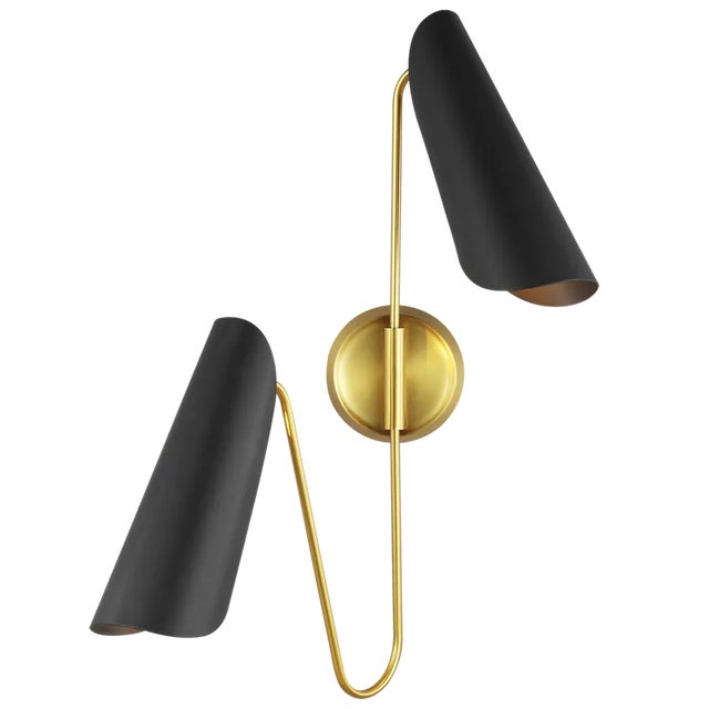 The Tresa two light wall sconce in burnished brass is a striking double sconce on a stylish two-level frame, featuring two...