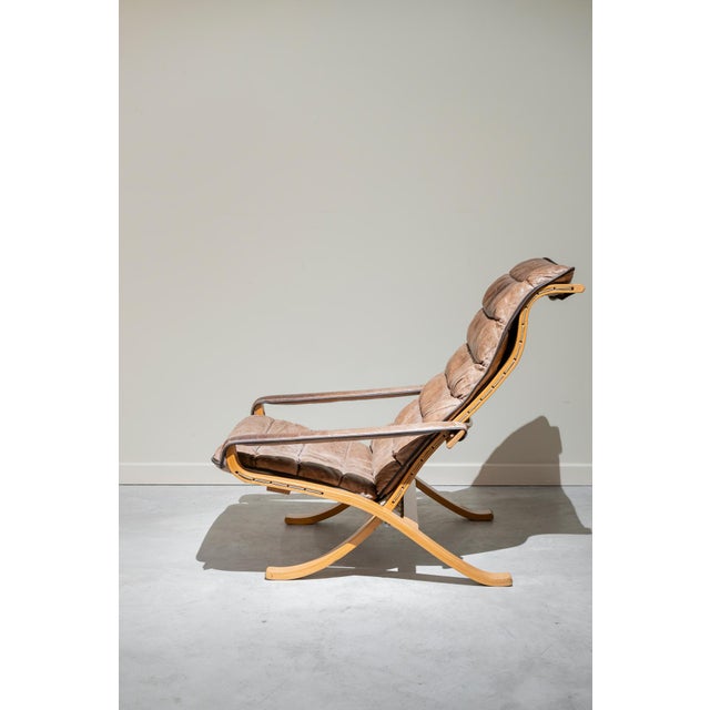 Folding and very comfortable single-seat armchair with arms from the 60s designed by Ingmar Relling. Original leather...