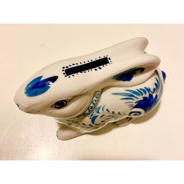 This item is a blue and white porcelain bunny rabbit money bank in a Chinoiserie style pattern, made of porcelain, these...