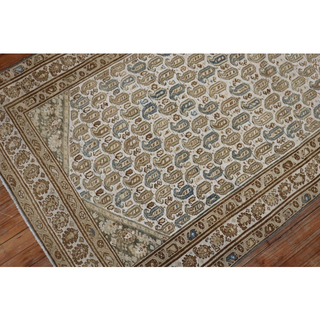 Fascinating Persian Malayer rug featuring a small paisley "boteh" design on an ivory ground, main accents in brown and...
